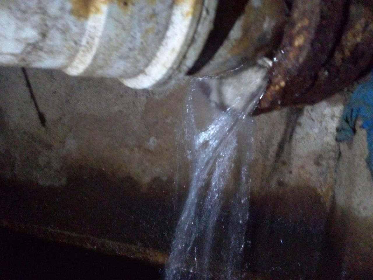 Water leaking from a damaged pipe joint